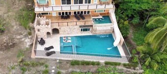 Costa Rica BEACH Castle with WATERSLIDE, WATERFALL, 2 Pools on SANDY BEACH 12ppl
