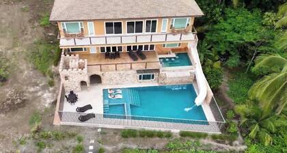 Costa Rica BEACH Castle with WATERSLIDE, WATERFALL, 2 Pools on SANDY BEACH 12ppl