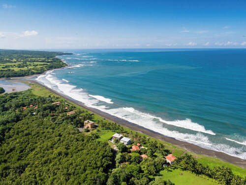Costa Rica BEACH Castle with WATERSLIDE, WATERFALL, 2 Pools on SANDY BEACH 12ppl