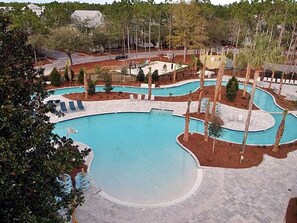 A swimming pool with multiple lanes and a surrounding deck area.