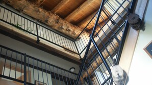 A multi-level wooden staircase with metal railings and a wooden beam structure. - Spectacular Large Group Accommodations with Gallatin River access! (Bozeman)