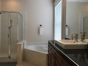 Combined shower/tub, hair dryer, towels, soap