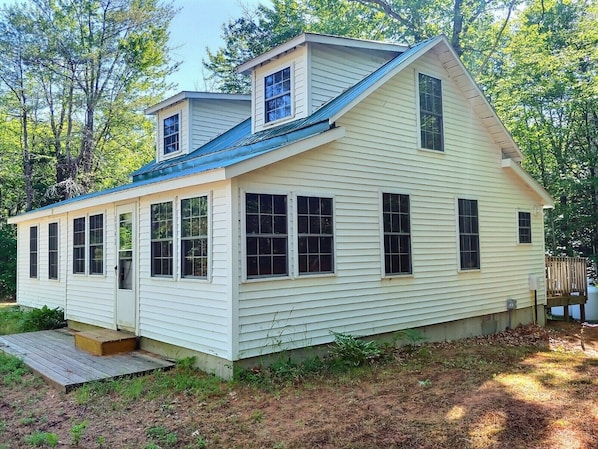 A single-story house with a gabled roof, a front porch, and a small deck. - Quaint, Rustic, Quiet Retreat (North Chatham)