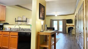 A compact living space with a kitchen, dining area, and a living room. - Sweet Drake - Unit 2103 - FREE Attraction Ticket with EACH night Stay Including Dollywood (Pigeon Forge)