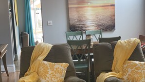 A living room with two leather armchairs, a yellow coffee table, and a painting on the wall. - Pool house Close to the strip 3bedroom pool bungalow  (Las Vegas)