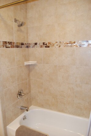 Combined shower/bathtub, hair dryer, towels, soap - Enjoy the large patio and shaded back yard of this large home with 2 kitchens (Colorado Springs)