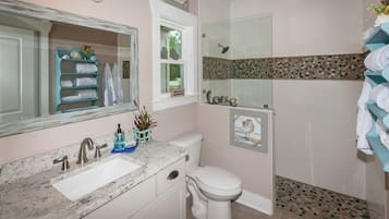 Bathtub, hair dryer, towels, soap