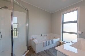 Bathtub, hair dryer, towels, soap