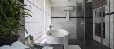 Deep soaking tub, rainfall showerhead, free toiletries, bathrobes