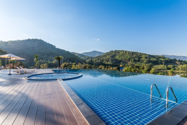 Outdoor pool, open noon to 9:00 PM, pool umbrellas, sun loungers