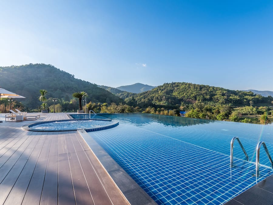 Outdoor pool, open noon to 9:00 PM, pool umbrellas, sun loungers