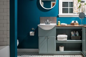 Combined shower/tub, hair dryer, towels, soap