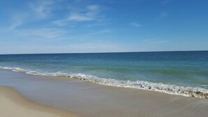 A beach with clear skies and calm waters. - Panoramic Oceanfront. Beautiful Five Star. The get-away for any season. (Bethany Beach)