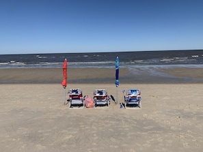 A beach with five beach chairs and two umbrellas. - 4 SHORT BLOCKS TO THE BEACH! Beautiful sunny home - deck & covered patio  (North Cape May)