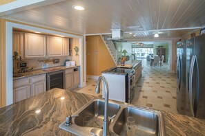 Fridge, microwave, oven, stovetop - Sunset River House - Home w/Pontoon Boat for rent. Private Dock. Sleeps 12 (Port Richey)
