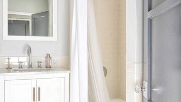 Combined shower/tub, hair dryer, towels, soap