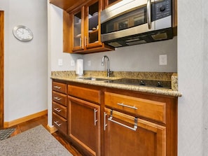 Fridge, microwave, stovetop, coffee/tea maker