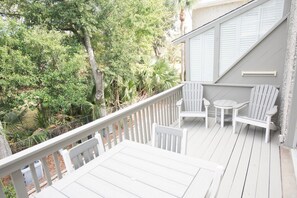 Outdoor dining - Steps from the pool and ocean! Four-level East Beach townhome with elevator! (Saint Simons Island)