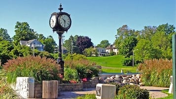 Stunning clock tower stands at the heart of this picturesque neighborhood, surrounded by beautifully manicured gardens and lush greenery.