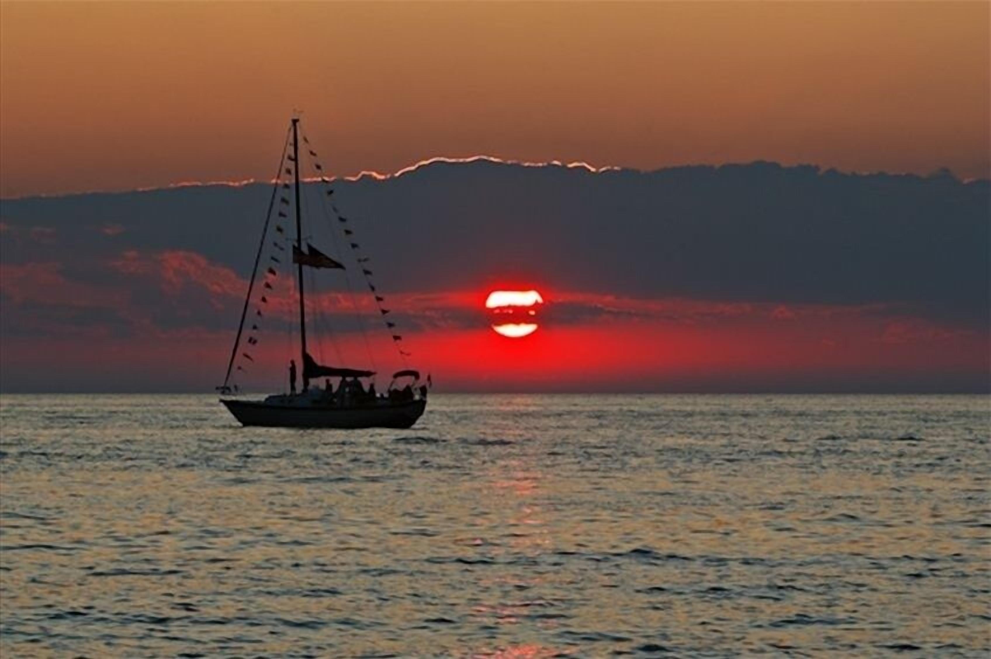 A boat on calm waters during sunset.