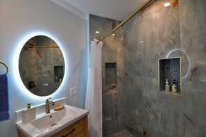 Bathtub, hair dryer, towels, soap