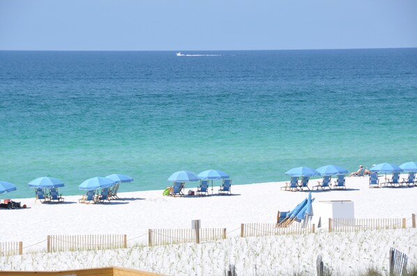 On the beach, sun loungers, beach towels