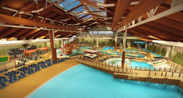 An indoor swimming pool with multiple lanes, a water slide, and a play area. - Upgraded condo in the heart of McCormick Ranch (Scottsdale)