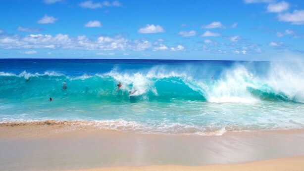 A beach with waves and a clear sky. - 2 story condo w/ Stunning Views and Many Amenities (Ocean View)