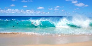 A beach with waves and a clear sky. - 2 story condo w/ Stunning Views and Many Amenities (Ocean View)