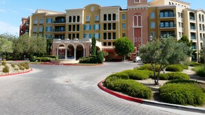 A multi-story hotel with a central courtyard, featuring a red-tiled roof, balconies, and a prominent tower. - TRANQUIL SETTING IN 6TH FLOOR, 1 BEDROOM 1 BATH CONDO WITH BREATHTAKING VIEW  (Henderson)