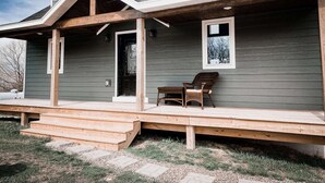 A two-story house with a covered porch and a small outdoor seating area. - PROMO 10% WEEKLY/20% MONTHLY DISCOUNT
SW Wisconsin, Hypoint’s Mississippi view (Eastman)