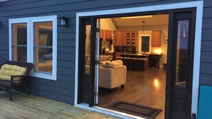 A modern house with a sliding glass door leading to a living room and kitchen area. - PROMO 10% WEEKLY/20% MONTHLY DISCOUNT
SW Wisconsin, Hypoint’s Mississippi view (Eastman)