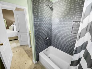 Bathtub, hair dryer, towels, soap