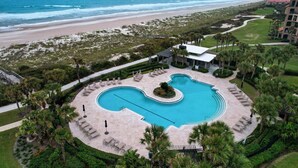 A resort with a large pool, beach access, and palm trees. - Turtle Dunes Oceanfront Ground floor 2br/2ba (Amelia Island)