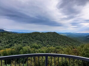 A mountainous landscape with dense forest coverage and a cloudy sky. - Affordable Rate with a Priceless View! (Sugar Mountain)
