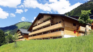 Situated on a hillside, this traditional chalet-style hotel offers stunning views of the surrounding landscape from its multiple balconies.