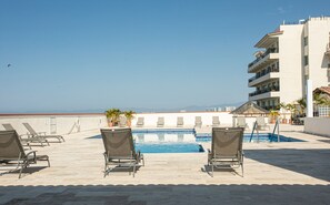 Outdoor pool - Check out the new bathrooms in this Ocean Front Condo # 409 with Roof top Pool (Puerto Vallarta)