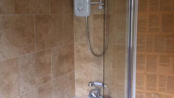 Combined shower/bathtub, hair dryer, towels, soap