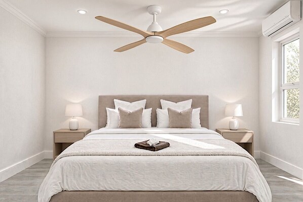 A bedroom with a bed, nightstands, a ceiling fan, and a window.