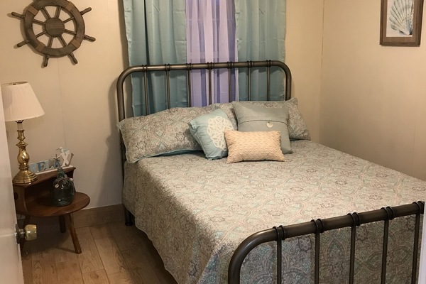 Master bedroom with new queen bed and mattress and on suite bathroom