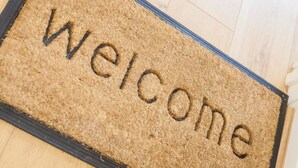 A doormat with the word "Welcome" in raised letters. - Eden Lodge (High Wycombe)