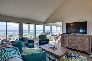 Télévision, cheminée, lecteur de DVD, baby-foot