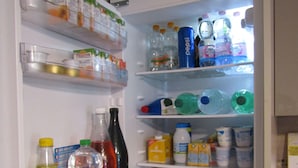 A refrigerator stocked with various beverages and food items. - B&B Dolce Dormire (Foggia)