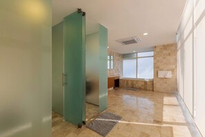 Bathtub, eco-friendly toiletries, hair dryer, towels