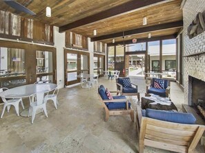 A spacious outdoor seating area with a fire pit, tables, and chairs. - 6 Seat Golf Cart-4 Bikes Included! Community Pool (Santa Rosa Beach)
