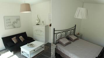 A modern bedroom with a bed, bedside table, and a white dresser.