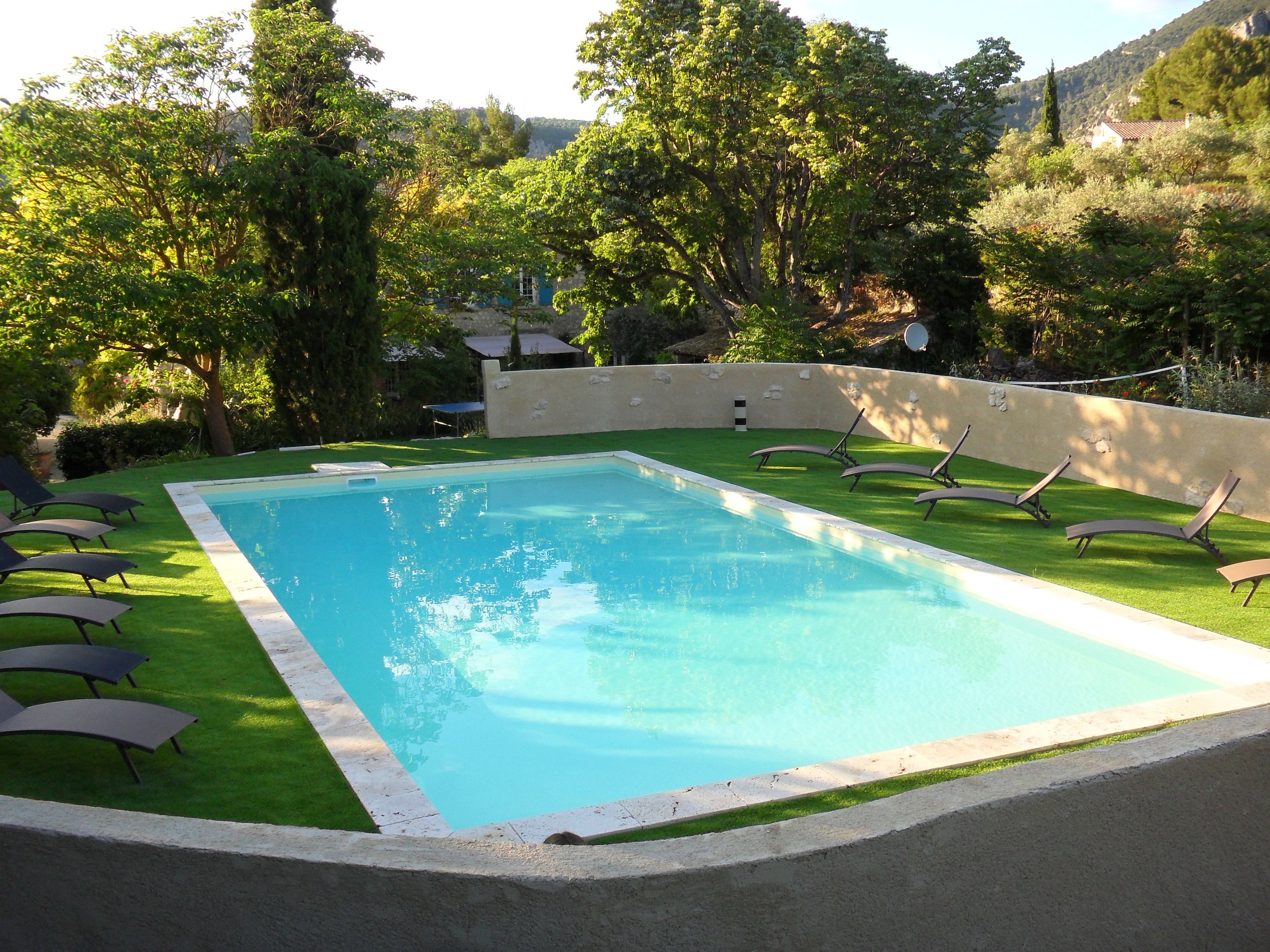 Seasonal outdoor pool, pool umbrellas, pool loungers