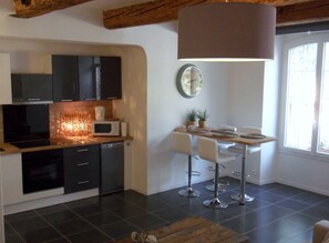 Apartment, Terrace, Ground Floor (ROMARIN) | Private kitchenette | Fridge, microwave, oven, stovetop - Bastide De La Lézardière (Fontaine-de-Vaucluse)