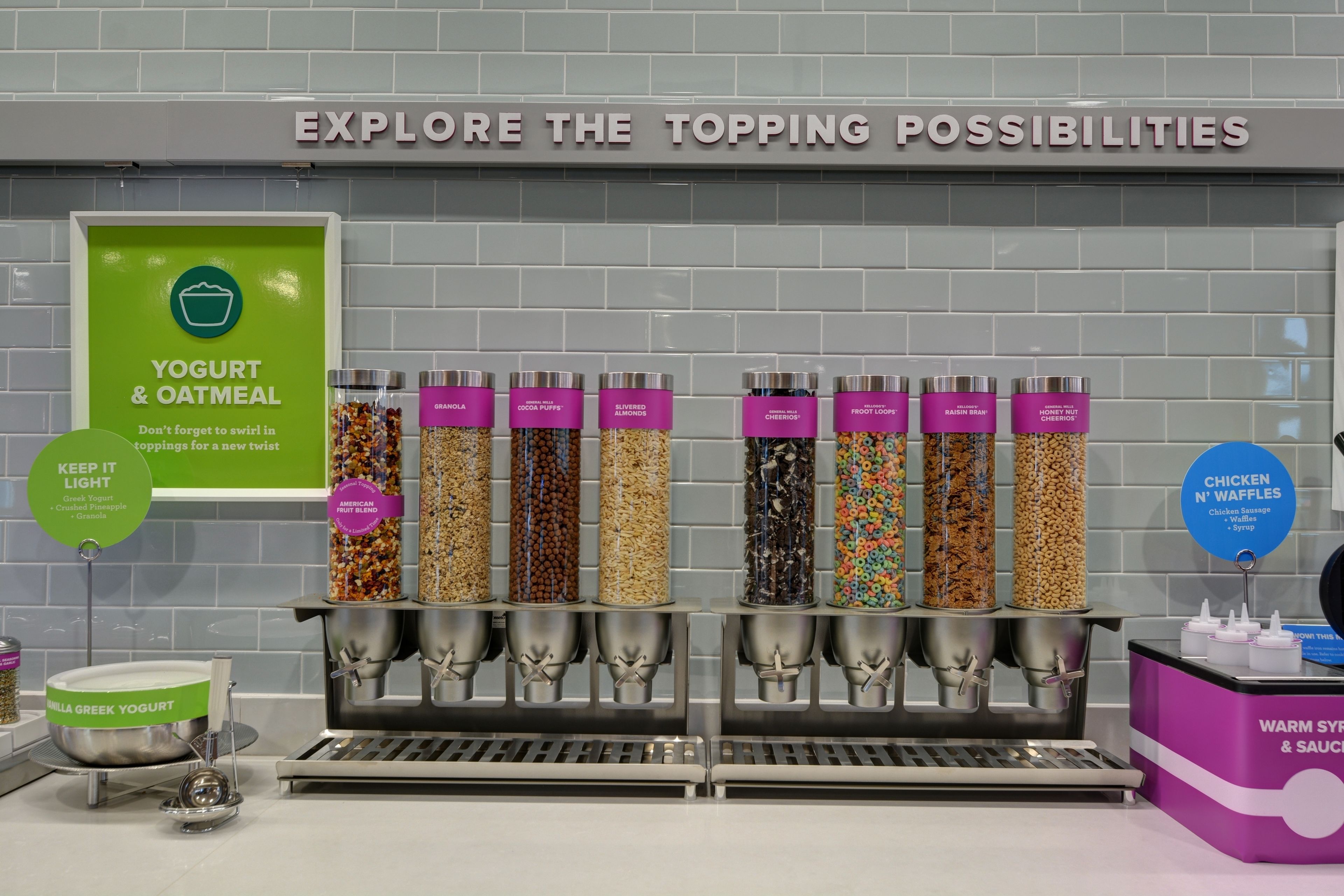 A yogurt and oatmeal station with various toppings.