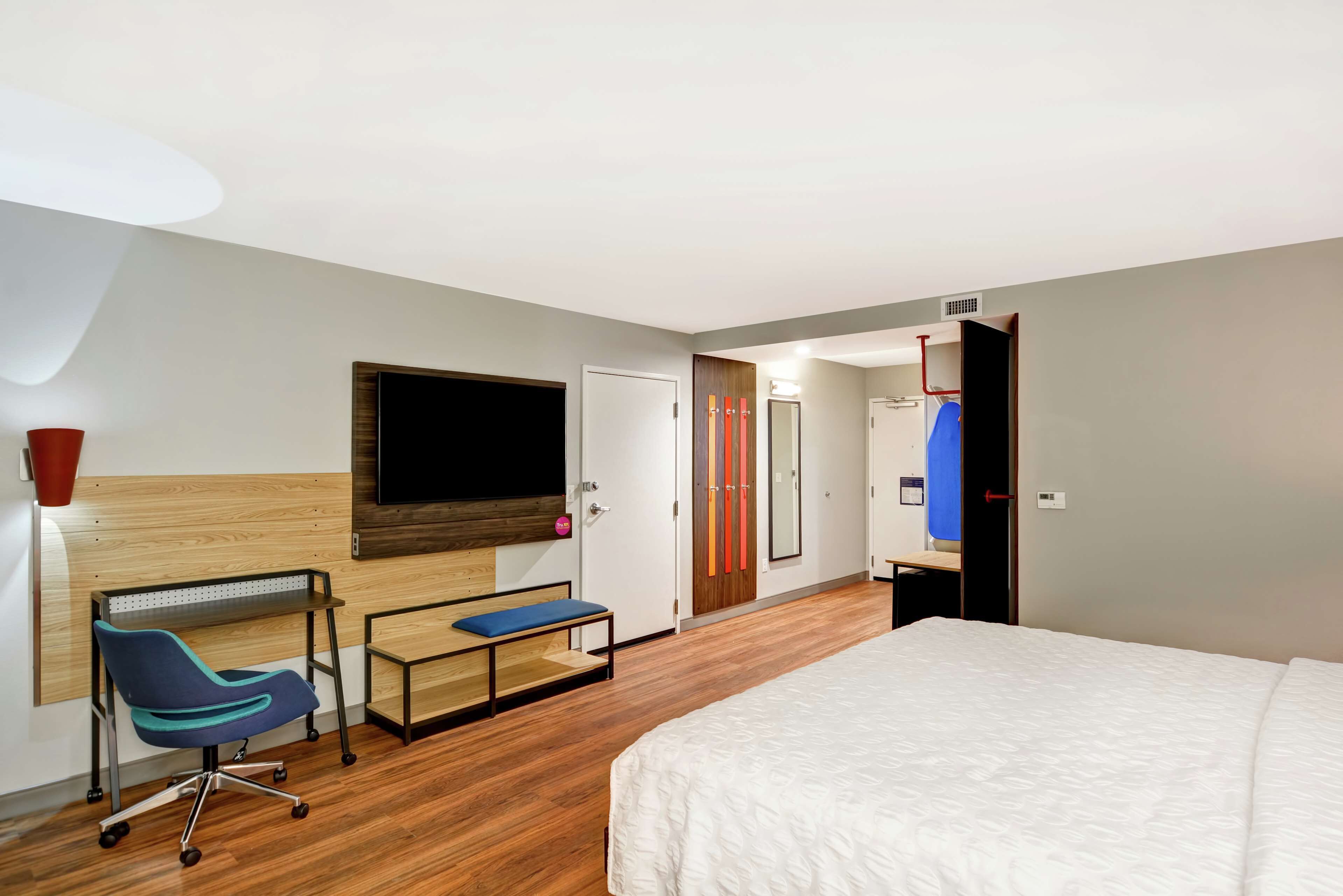 desk, laptop workspace, blackout curtains, iron/ironing board